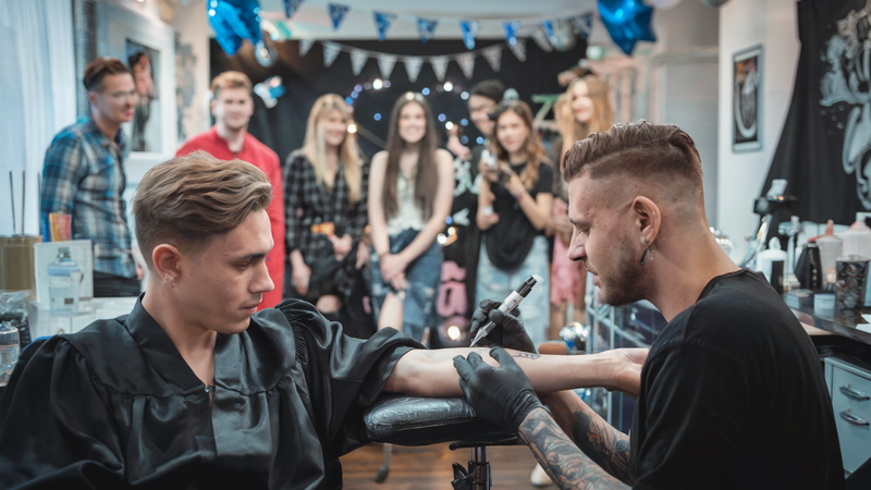 Professional tattoo artist showcasing artwork